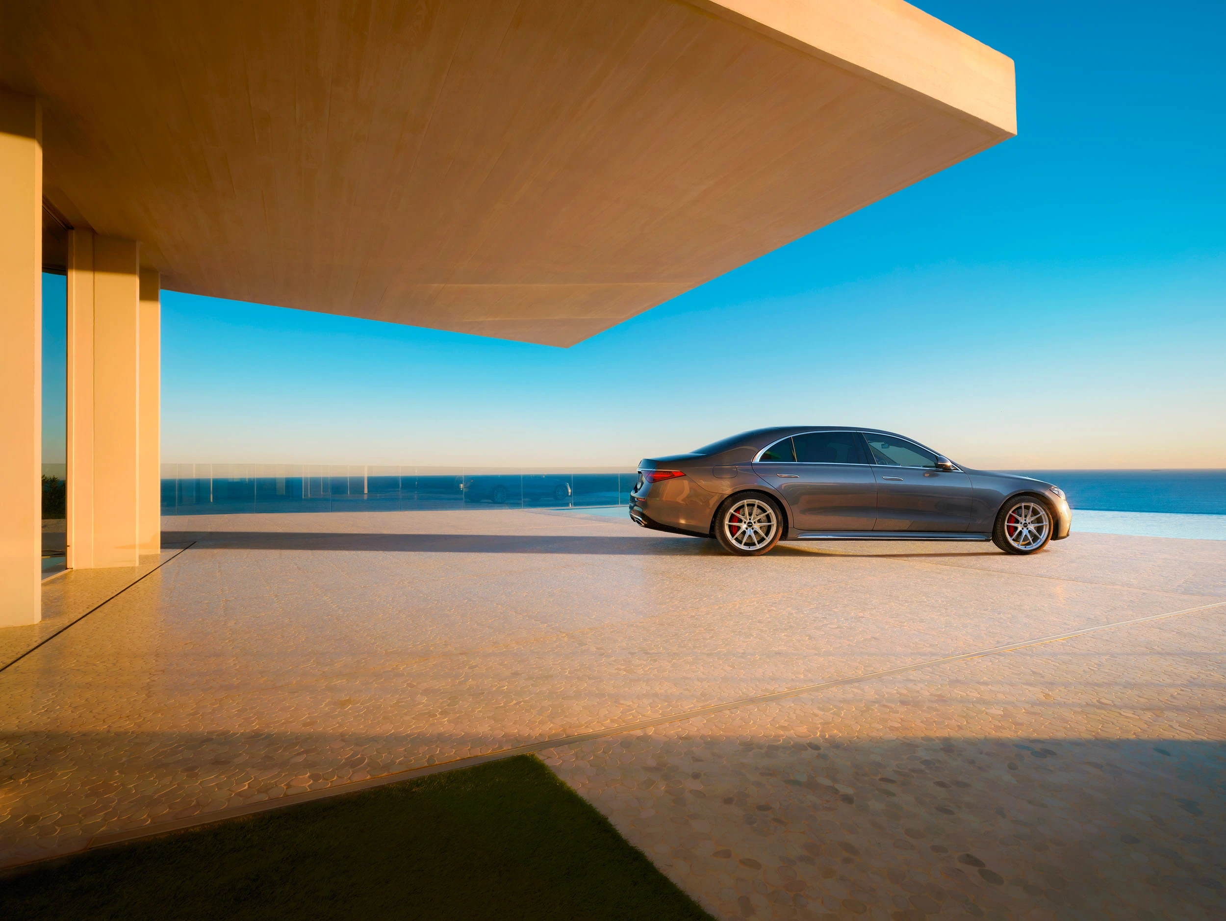 Grey Mercedes-Benz S-Class with silver LSW forged wheels on a coastal terrace